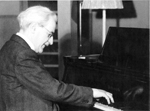 Photograph of Moriz Violin playing the piano.